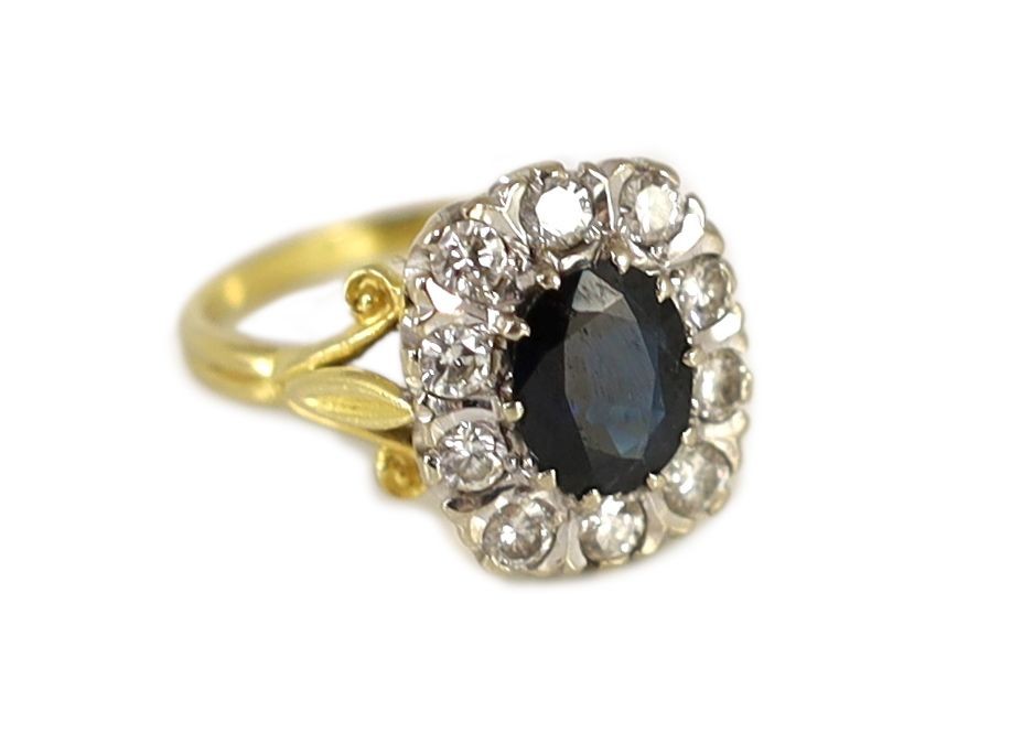 A 1970's 18ct gold, sapphire and diamond set rounded rectangular cluster ring